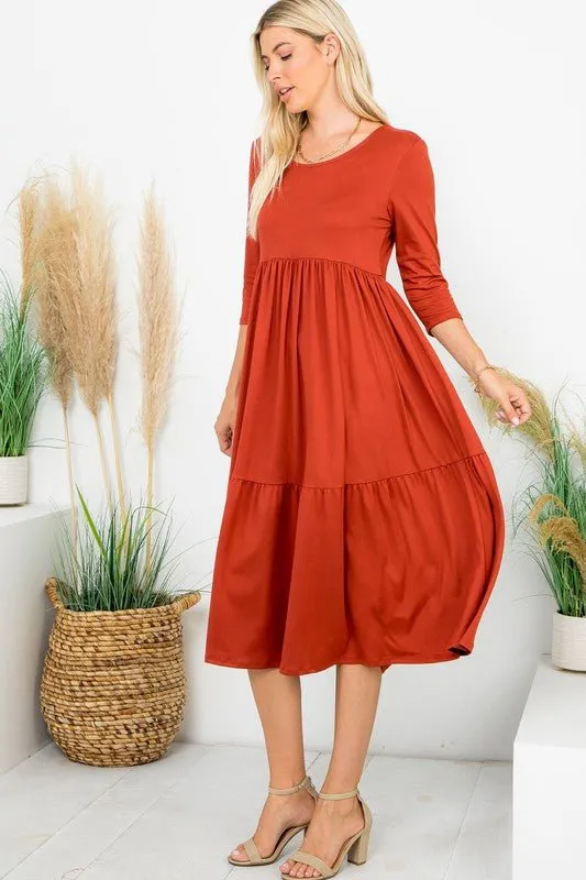 A Joy Forever Tiered Midi Dress in Rust